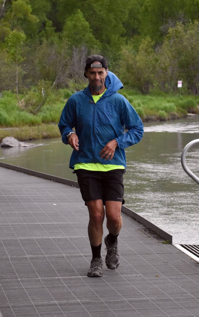 Talkeetnas Tony Covarrubias runs along the Kenai River in the Tsalteshi Backyard Ultra on Friday, June 9, 2023, in Soldotna, Alaska. (Photo by Jeff Helminiak/Peninsula Clarion)