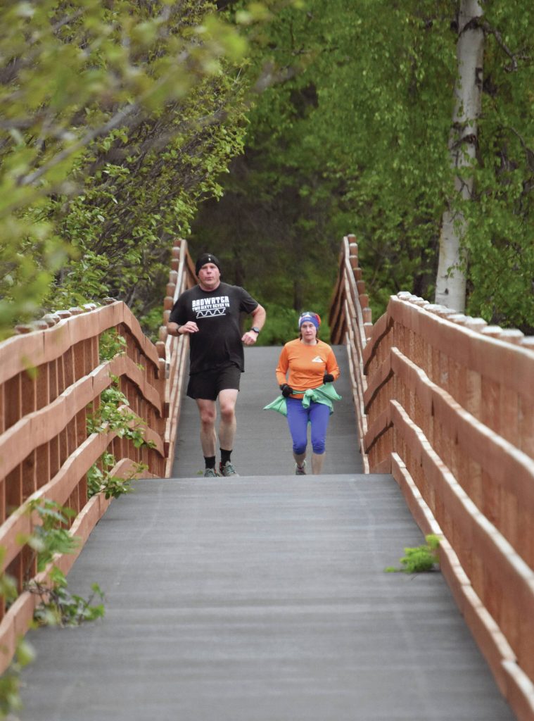 Photo by Jeff Helminiak/Peninsula Clarion
Kenais Eric Thomason leads Homers Yvonne Leutwyler in the Tsalteshi Backyard Ultra on Frida in Soldotna.