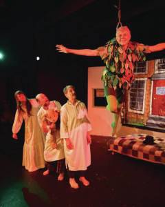 Photo by Christopher Kincaid
Sarah Brewer, Ken Goldman and Maggie Quarton watch Peter Pan fly on the Pier One Theatre stage on Homer Spit.