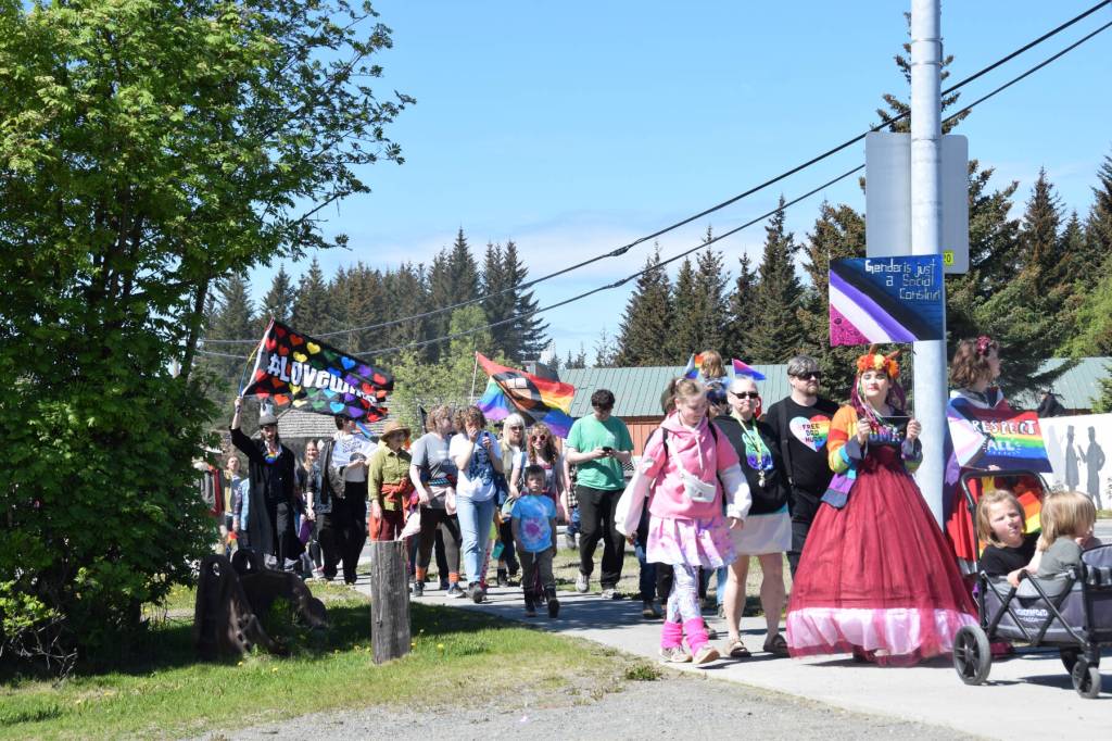 Homer community members parade down Pioneer Avenue on their way to the Liberation Celebration at WKFL Park hosted by Homer Pride on Saturday, June 17, 2023 in Homer Alaska. (Delcenia Cosman/Homer News)