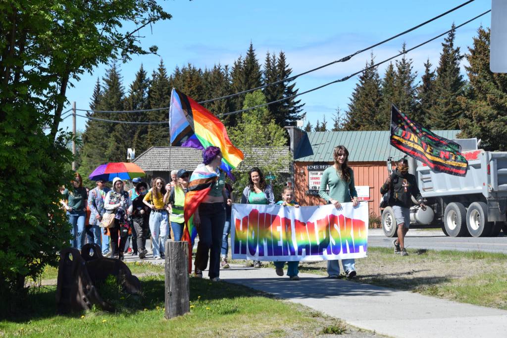 Homer community members parade down Pioneer Avenue on their way to the Liberation Celebration at WKFL Park hosted by Homer Pride on Saturday, June 17, 2023 in Homer Alaska. (Delcenia Cosman/Homer News)