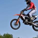 A racer flies through the air at the Alaska State Motocross Race 3 on Saturday, June 17, 2023, at Twin City Raceway in Kenai, Alaska. (Photo by Jeff Helminiak/Peninsula Clarion)