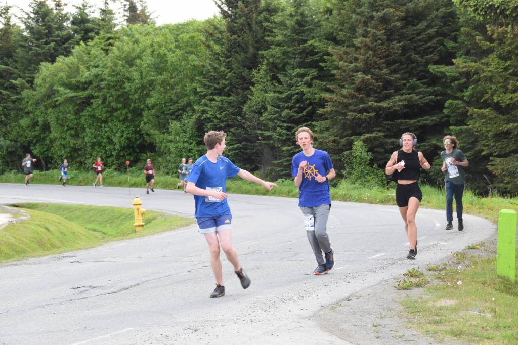 Runners participating in the Homer Spit Run 10K to the Bay race round the curve of Ben Walters Lane on Saturday, June 24, 2023 in Homer, Alaska. (Delcenia Cosman/Homer News)