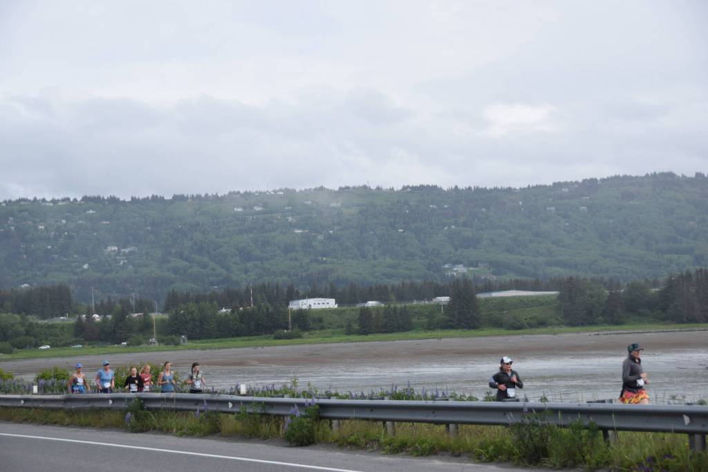 Participants in the Homer Spit Run 10K to the Bay race run down the Spit Road toward the finish line at Lands End on Saturday, June 24, 2023 in Homer, Alaska. (Delcenia Cosman/Homer News)