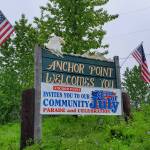 A banner inviting the community to Anchor Points annual Fourth of July celebrations is posted by the Sterling Highway heading south on Saturday, June 24, 2023 in Anchor Point, Alaska. (Delcenia Cosman/Homer News)