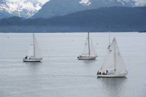 Members of the Homer Yacht Club start the course set for the Homer Yacht Club Regatta on Saturday, June 26, 2023 in the Kachemak Bay below Land's End Resort in Homer, Alaska. Homer Yacht Club Commodore Craig Forrest is on number 93, the Arctica.