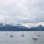 Members of the Homer Yacht Club start the course set for the Homer Yacht Club Regatta on Saturday, June 26, 2023 in the Kachemak Bay below Lands End Resort in Homer, Alaska. The orange buoy, left, marks the starting point of Saturdays course, the route of which was revealed to participants minutes before the beginning of the race. (Delcenia Cosman/Homer News)