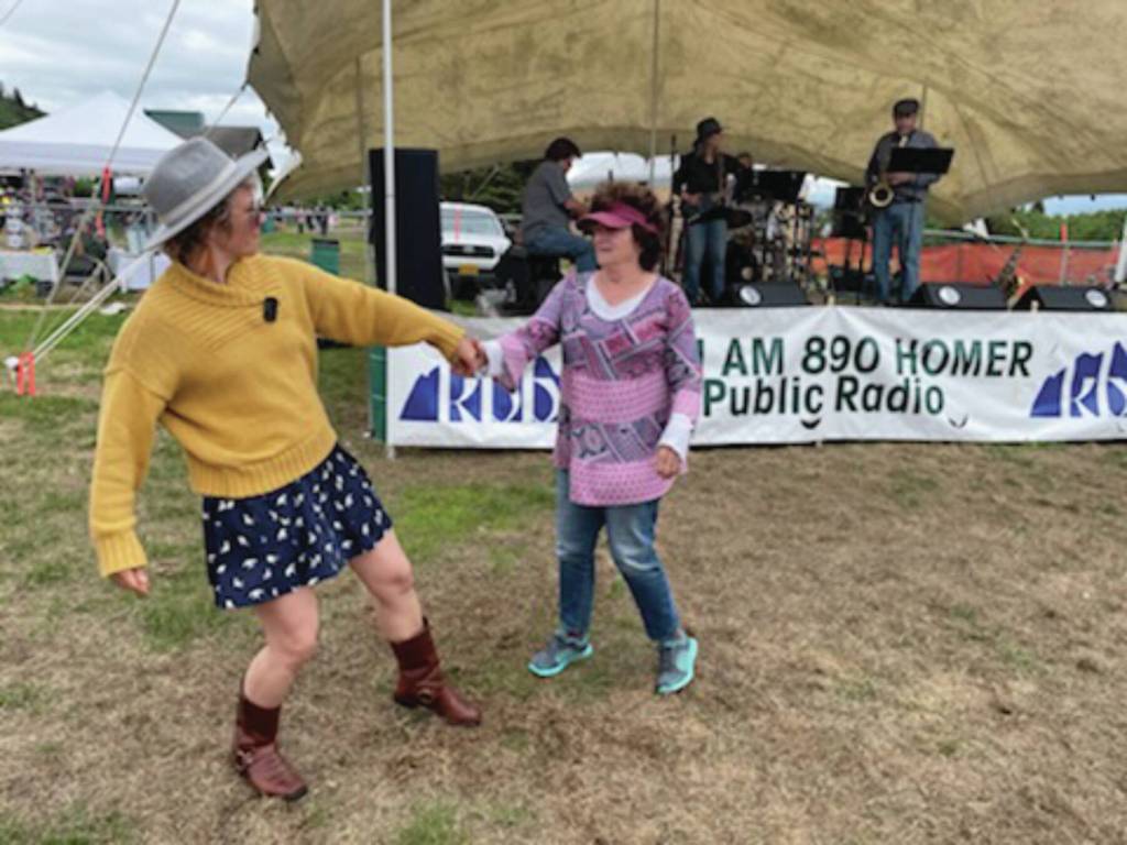 Libby Bushell and Sharon Bushell dance to Johnny B. performing on the piano at KBBIs Concert on the Lawn. Emilie Springer/ Homer News