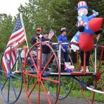 Community members ride on the Anchor Point VFW Post 10221 float down School Street during the Anchor Point Fourth of July parade on Tuesday, July 4, 2023 in Anchor Point, Alaska. (Delcenia Cosman/Homer News)