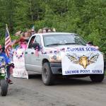 The Chapman School float makes it way down School Street during the Anchor Point Fourth of July parade on Tuesday, July 4, 2023 in Anchor Point, Alaska. (Delcenia Cosman/Homer News)