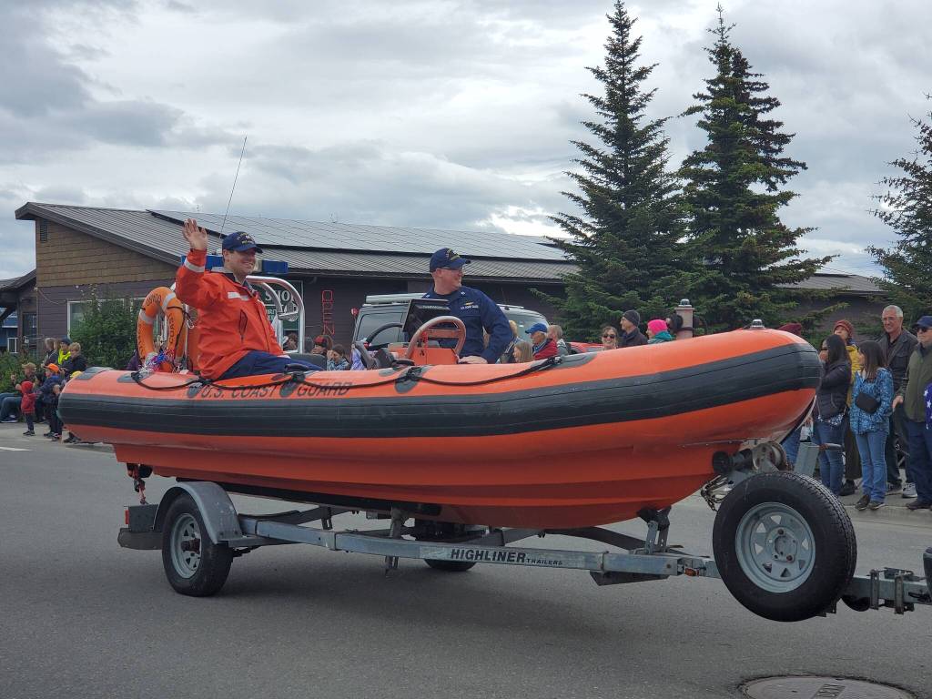 The U.S. Coast Guard ride their float down Pioneer Avenue during the Seas the Day parade on Tuesday, July 4, 2023 in Homer, Alaska. (Delcenia Cosman/Homer News)