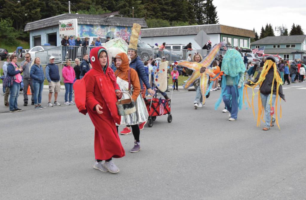 Local sea creatures swim past the Homer Bookstore at the Seas the Day parade on Tuesday, July 4<ins>, 2023</ins> in Homer<ins>, Alaska</ins>.