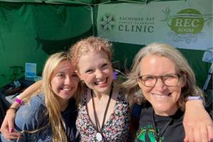 Kachemak Bay Family Planning Clinic volunteers Fiona Hatton and Olivia Glasman and CEO Claudia Haines (right) provide outreach at Salmonfest in 2022. Photo provided by KBFPC