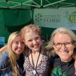 Kachemak Bay Family Planning Clinic volunteers Fiona Hatton and Olivia Glasman and CEO Claudia Haines (right) provide outreach at Salmonfest in 2022. Photo provided by KBFPC