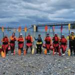Photo provided by coordinator Alex Ravelo
Girls on the water participants and instructors with their kayak paddles in July.
