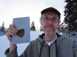 Photos provided by Brian George Smith
Author Brian George Smith poses with his book, Ida Mae Joy: Gold Dust Dreams, published in 2021.