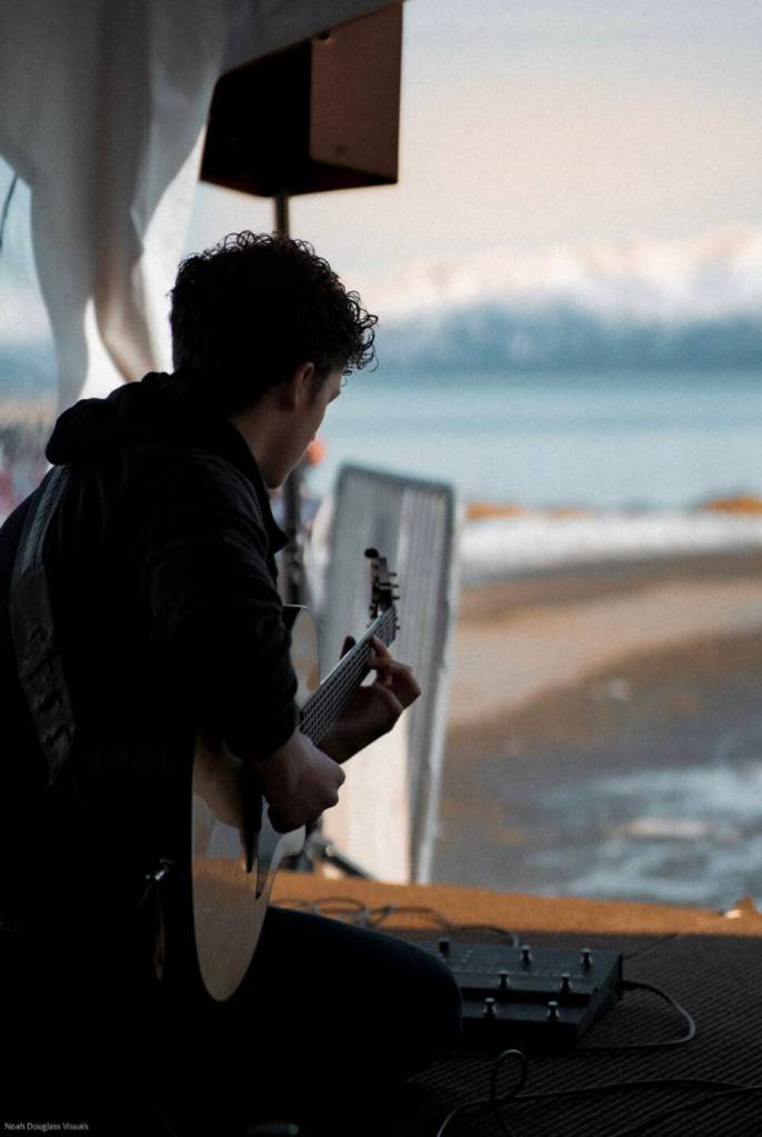 Silas Luke Jones performs at the Homer Chamber of Commerce Winter King Salmon Derby on the Homer Spit in Feb. 2023 in Homer, Alaska. Photo by Noah Douglas Visuals
