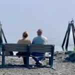 A couple enjoys the view from the end of the road at the park by Lands End Resort on Thursday, July 20, 2023 in Homer, Alaska. Photo by Christina Whiting