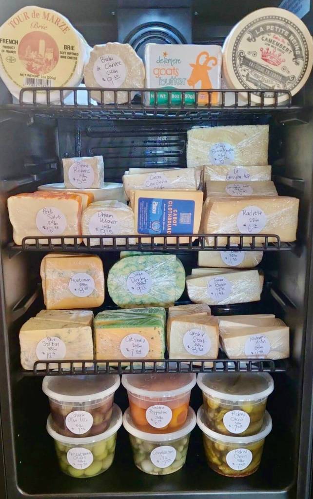 An assortment of cheeses, olives and other specialty items that rotate through Alasandros Market on Heath Street is on display at the shop. Photo courtesy of Jacob Chrisman