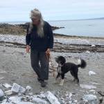 Seldovia artist Jenifer Cameron walks her dog, Penelope, on Outside Beach in early 2023, looking for kelp for her current exhibit of collage photography, Beauty and the Beach, on display at Homer Council on the Arts through July. Photo courtesy Jenifer Cameron