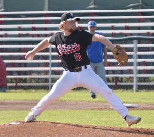 Harrison Metz of the Peninsula Oilers delivers to the Anchorage Glacier Pilots on Saturday, July 22, 2023, at Coral Seymour Memorial Park in Kenai, Alaska. (Photo by Jeff Helminiak/Peninsula Clarion)