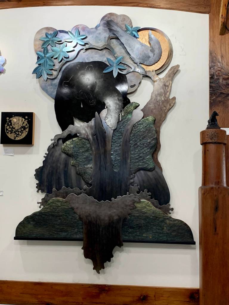 Fishing Bear with Raven, a wall sculpture by Homer artist Jeff Dean, is on display at Creative Fire Studios out East End Road through August in Homer, Alaska. Photo provided by Jeff Dean