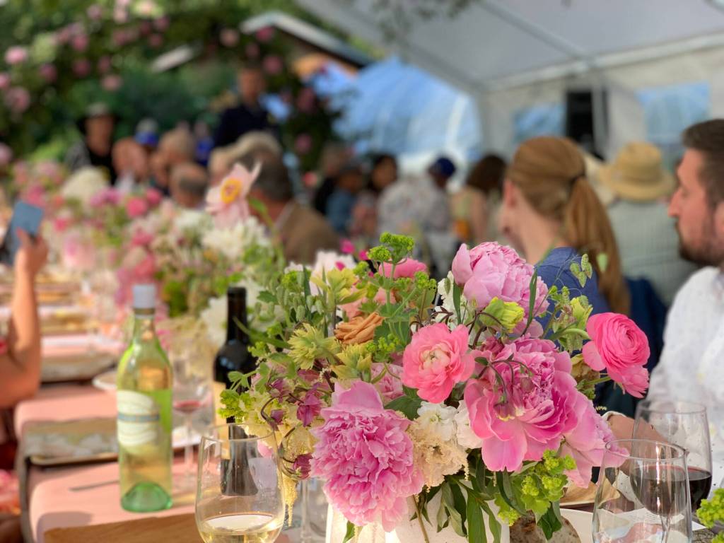 Floral bouquets line tables during an American Grown Field-to-Vase Dinner at Scenic Place Peonies on Sunday, July 23, 2023 in Homer, Alaska. Photo by Christina Whiting