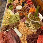 A grazing board, also known as a charcuterie board, is prepared Saturday, July 22, 2023, in Kenai, Alaska. (Photo by Tressa Dale/Peninsula Clarion)