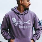 A Sirens & Sailors hoodie, photographed in the summer of 2023, showcases a sample of the Homer businesss artwork. Photo by Kristian Irey