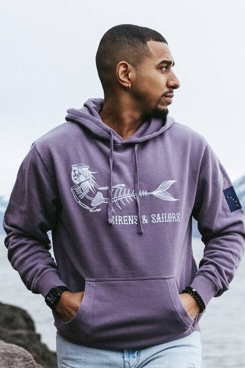 A Sirens & Sailors hoodie, photographed in the summer of 2023, showcases a sample of the Homer businesss artwork. Photo by Kristian Irey