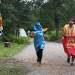Fish and chips costumed runners cross the finish line in the inaugural Great Salmon Run 5K race on Saturday, Aug. 5, 2023 during Salmonfest at the Kenai Peninsula Fairgrounds in Ninilchik, Alaska.