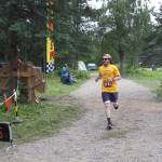 Clay Henson crosses the finish line in the inaugural Great Salmon Run 5K race on Saturday, Aug. 5, 2023 during Salmonfest at the Kenai Peninsula Fairgrounds in Ninilchik, Alaska. (Delcenia Cosman/Homer News)