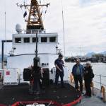 Emilie Springer/ Homer News
USCG officer Alexander Curran shows Homer visitors the bow of the USCG Cutter Naushon.