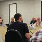 Outlaw Body and Paints Wesley Jackson (center) testifies before the Kenai Peninsula Borough Assembly about the affects of calcium chloride brine on vehicles he treats during a meeting on Tuesday in Soldotna. (Ashlyn OHara/Peninsula Clarion)