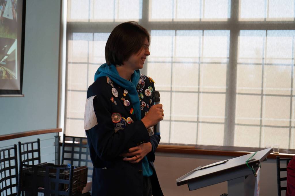 Thomas Smith, a high school student from Kenai who recently completed a year-long exchange program in France, speaks to the Soldotna Rotary Club about his experience at Addie Camp in Soldotna, Alaska, on Thursday, Aug. 3, 2023. (Jake Dye/Peninsula Clarion)
