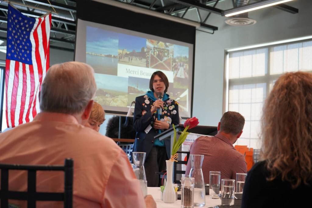 Thomas Smith, a high school student from Kenai who recently completed a yearlong exchange program in France, speaks to the Soldotna Rotary Club about his experience at Addie Camp in Soldotna, Alaska, on Thursday, Aug. 3, 2023. (Jake Dye/Peninsula Clarion)