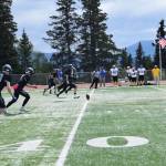 Mariner running back Jake Tappan kicks off the home opener varsity game on Saturday, Aug. 12, 2023 at the Homer High School football field in Homer, Alaska. (Delcenia Cosman/Homer News)