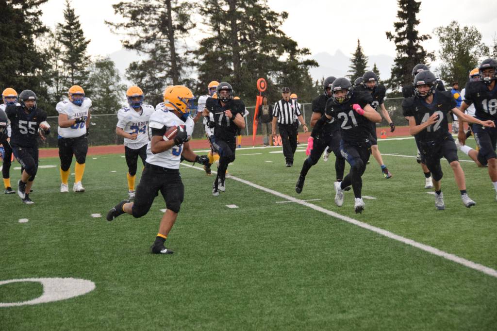 Barrows Gabriel Ortilla faces off against incoming Mariners in the fourth quarter of the home opener game on Saturday, Aug. 12, 2023 in Homer, Alaska. (Delcenia Cosman/Homer News)