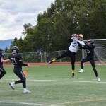 Barrows Ethan Goodwin catches a pass from Dwight Unutoa, taking the Whalers first touchdown of the game on Saturday, Aug. 12, 2023 in Homer, Alaska (Delcenia Cosman/Homer News)