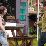Attendees dance in the rain at the Kenai Peninsula Fair in Ninilchik, Alaska, on Friday, Aug. 11, 2023. (Jake Dye/Peninsula Clarion)