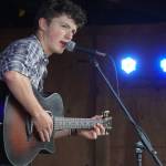 Silas Luke Jones performs on the Ocean Stage at the Kenai Peninsula Fair in Ninilchik, Alaska, on Friday, Aug. 11, 2023. (Jake Dye/Peninsula Clarion)