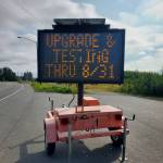 A traffic message board on the Sterling Highway on Friday, Aug. 18, 2023 alerts community members that tsunami siren upgrades and testing will continue through Aug. 31 in Homer, Alaska. (Delcenia Cosman/Homer News)
