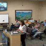 Public Works director Jan Keiser provides background on the Kachemak Sponge Green Infrastructure Stormwater Treatment System project during a public hearing held on Monday, Aug. 14, 2023 at City Hall in Homer, Alaska. Screenshot.
