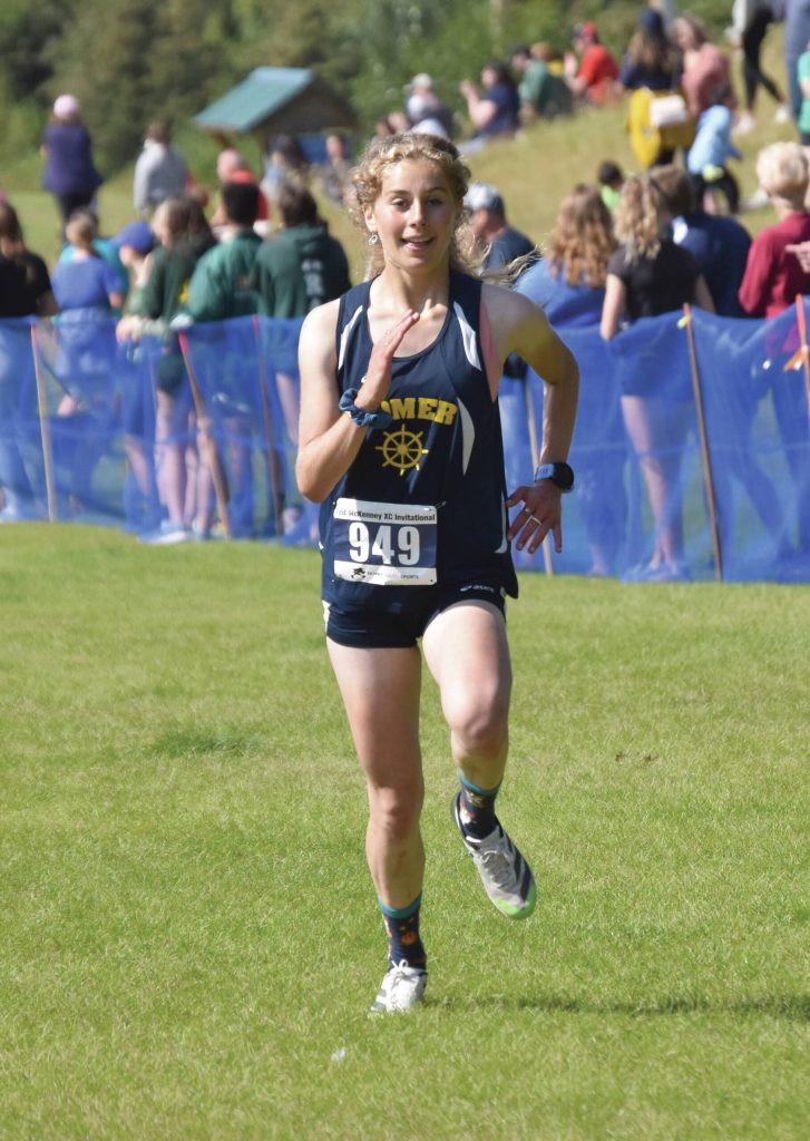 Homer's Daisy MossWalker sprints to the finish in the girls varsity race at the Ted McKenney Invitational on Saturday, Aug. 19, 2023, at Tsalteshi Trails just outside of Soldotna, Alaska. (Photo by Jeff Helminiak/Peninsula Clarion)