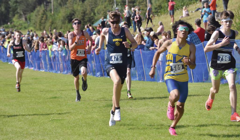 Homer's Ethan Styvar sprints to the finish in the boyss varsity race at the Ted McKenney Invitational on Saturday, Aug. 19, 2023, at Tsalteshi Trails just outside of Soldotna, Alaska. (Photo by Jeff Helminiak/Peninsula Clarion)