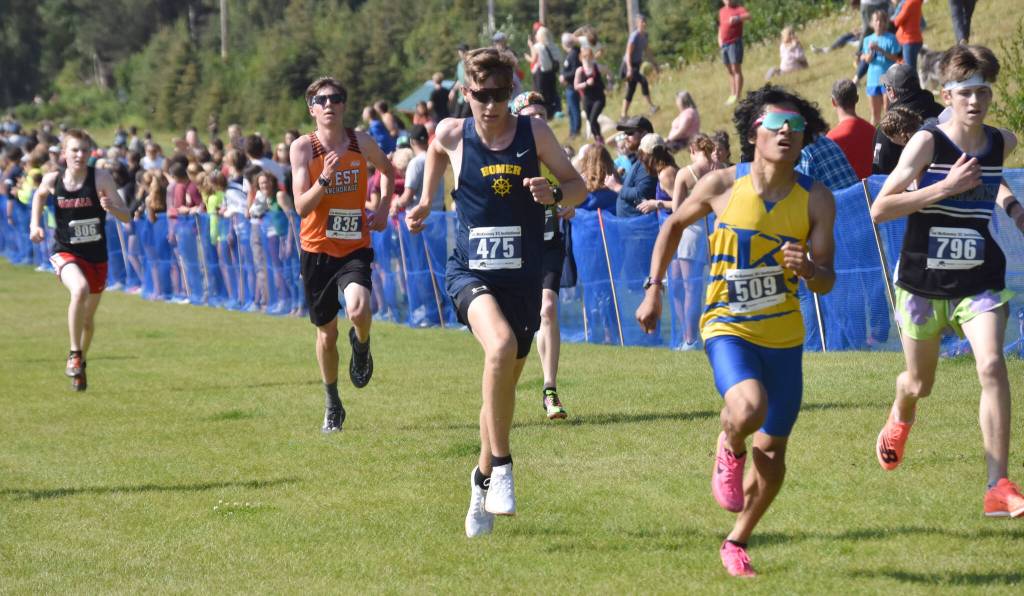 Homers Ethan Styvar sprints to the finish in the boyss varsity race at the Ted McKenney Invitational on Saturday, Aug. 19, 2023, at Tsalteshi Trails just outside of Soldotna, Alaska. (Photo by Jeff Helminiak/Peninsula Clarion)