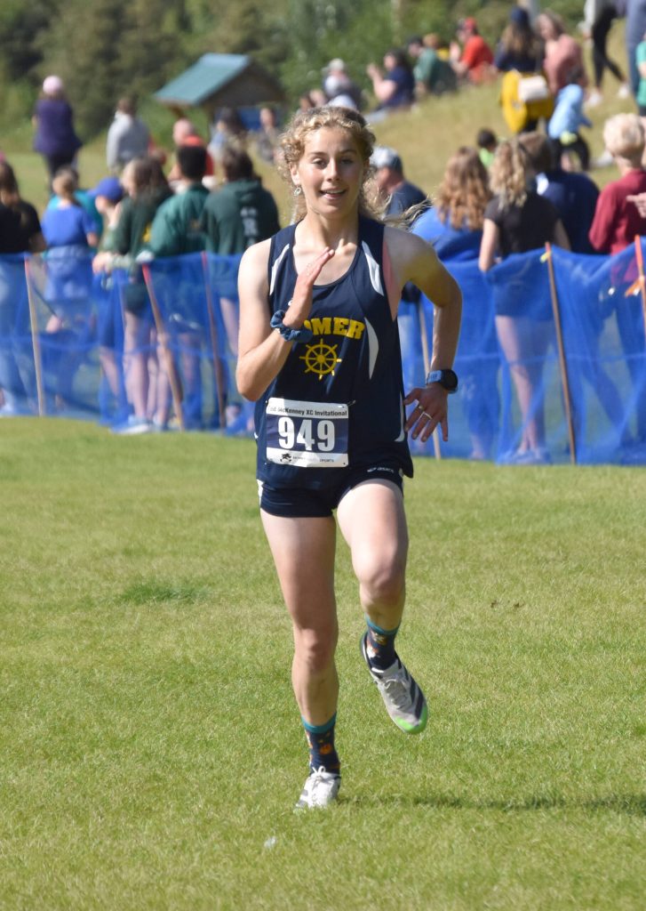Homers Daisy MossWalker sprints to the finish in the girls varsity race at the Ted McKenney Invitational on Saturday, Aug. 19, 2023, at Tsalteshi Trails just outside of Soldotna, Alaska. (Photo by Jeff Helminiak/Peninsula Clarion)