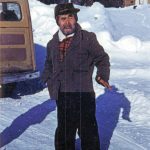Sergei Pete Peteroff, a Lancashire family neighbor who lived by Eagle Rock on the Kenai River, poses for a photo in the 1950s. The Lancashire vehicle can be seen at left. (Photo courtesy of the Lancashire Family Collection)