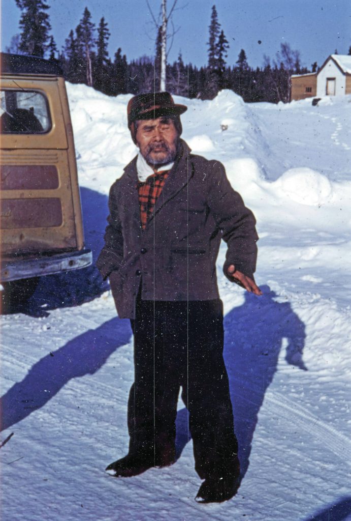 Sergei Pete Peteroff, a Lancashire family neighbor who lived by Eagle Rock on the Kenai River, poses for a photo in the 1950s. The Lancashire vehicle can be seen at left. (Photo courtesy of the Lancashire Family Collection)