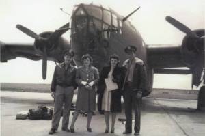 Larry and Rusty Lancashire (at left) pose in front of a B-24 bomber in the early 1940s with another unidentified couple. Larry was a B-24 co-pilot during World War II. (Photo courtesy of the Lancashire Family Collection)